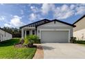 Attractive single Gathering home with well-maintained lawn and two car garage at 34747 Telluride Ln, Zephyrhills, FL 33541