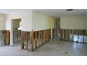 Open-concept living room featuring demoed walls, ready to customize with your own vision and creativity at 4964 Huntington Ne St, St Petersburg, FL 33703