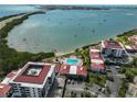 Aerial view of Isla del Sol condo featuring community pool, bay access, and parking at 6365 Bahia Del Mar Blvd # 112, St Petersburg, FL 33715