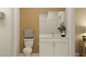 Stylish bathroom featuring a toilet, white cabinets, granite countertop, framed mirror, and tiled shower at 6866 E 115Th St, Palmetto, FL 34221