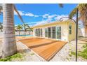 Spacious wooden deck with sliding glass doors perfect for indoor/outdoor living at 7984 1St S Ave, St Petersburg, FL 33707