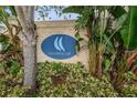 Community sign for Callista Cay surrounded by lush greenery at 876 Callista Cay Loop, Tarpon Springs, FL 34689