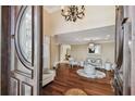 Elegant living room with hardwood floors, chandelier, and a decorative compass inlay at 1336 51St Ne Ave, St Petersburg, FL 33703