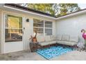 Cozy front porch with a comfortable seating area and cheerful decorations at 2195 Glen Dr, Safety Harbor, FL 34695