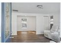 Bright and spacious living room with modern flooring and fresh white walls at 2195 Glen Dr, Safety Harbor, FL 34695