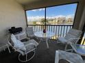 Inviting screened patio with table and chairs offering peaceful waterfront views at 4515 Whitton Way # 121, New Port Richey, FL 34653