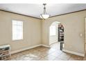 Bright living area featuring tile flooring, ample natural light, and an open layout at 5202 Cumberland Dr, Tampa, FL 33617