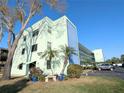 Exterior shot of condo building on sunny day at 5973 Terrace Park N Dr # 301, St Petersburg, FL 33709