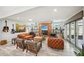 Spacious living room with a fireplace, comfortable sofas, and stylish decor at 105 Country Villas Dr, Safety Harbor, FL 34695