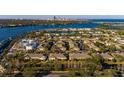 Panoramic aerial shot showcasing community's waterfront location, convenient city access, and proximity to various amenities at 122 Coquina Bay Dr, St Petersburg, FL 33705