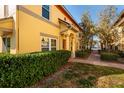 Inviting exterior with meticulous landscaping, creating a warm and welcoming ambiance that enhances curb appeal and charm at 122 Coquina Bay Dr, St Petersburg, FL 33705