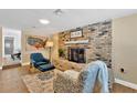 Cozy living room with a brick fireplace and comfortable seating, perfect for relaxing at 2510 Chapel Way, Tampa, FL 33618
