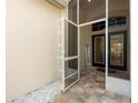 Inviting tiled entryway with a screen door welcomes you into the home at 4421 Larkenheath Dr, Spring Hill, FL 34609