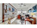 Office featuring a decorative wood wall and built in shelving at 5317 Del Coronado Dr, Apollo Beach, FL 33572