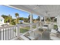 Relaxing covered balcony with comfortable seating and scenic views at 6841 Oelsner St, New Port Richey, FL 34652