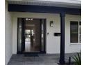 Modern front door showcasing the light-filled interior of the home at 1324 51St Ne Ave, St Petersburg, FL 33703