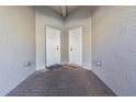 Inviting entrance with double doors, decorative mat, and neutral tones, creating a welcoming ambiance at 18012 Melibee Stone St, Tampa, FL 33647