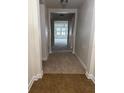 Inviting hallway with tile entry leading to a carpeted living area flooded with natural light at 2916 Shetland Ridge Dr, Valrico, FL 33596