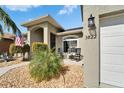 Charming home featuring a manicured yard with a cozy seating area and decorative rock landscaping at 3822 Salida Delsol Dr, Sun City Center, FL 33573