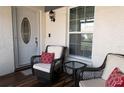 Cozy front porch with comfortable seating, perfect for enjoying the outdoors at 3942 La Costa Ln, Largo, FL 33771