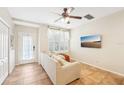 Comfortable living room with neutral tones, a ceiling fan, and tile flooring at 6040 Fishhawk Crossing Blvd # 6040, Lithia, FL 33547