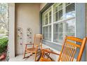 Cozy porch featuring rocking chairs, perfect for relaxing outdoors at 6040 Fishhawk Crossing Blvd # 6040, Lithia, FL 33547