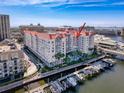 Harbor condo building with boat slips, waterfront pool, palm trees, and luxurious architecture at 700 S Harbour Island Blvd # 721, Tampa, FL 33602