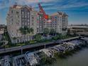 Harbor condo building with boat slips, waterfront pool, palm trees, and luxurious architecture at 700 S Harbour Island Blvd # 721, Tampa, FL 33602