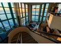 Spacious living room with floor-to-ceiling windows and ocean views from the upper level at 1520 Gulf Blvd # Ph1 1901, Clearwater Beach, FL 33767