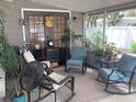 Enclosed patio with comfortable seating, potted plants, and a relaxing atmosphere at 1811 Ridge S Rd, Largo, FL 33778