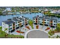 Modern townhomes featuring private garages, landscaped courtyards, and contemporary architectural details at 777 Gran Kaymen Way, Apollo Beach, FL 33572