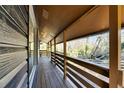 Relaxing covered wooden deck with an outdoor view at 8204 Stoner Rd, Riverview, FL 33569