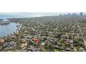 Aerial view of a residential area near a bay with downtown city views in the background at 114 27Th N Ave, St Petersburg, FL 33704