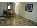 Inviting living room featuring light wood-look floors and neutral wall colors at 1372 S Hillcrest Ave, Clearwater, FL 33756