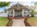 Charming single-Gathering home with a quaint front porch and detailed trim work at 1924 W Carmen St, Tampa, FL 33606