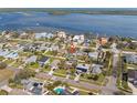 Aerial view of neighborhood homes, showing proximity to the ocean and the in-ground pool located on the property at 5926 Bayou Grande Ne Blvd, St Petersburg, FL 33703