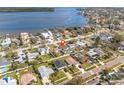 Wide aerial shot showcases proximity to ocean and neighborhood, including a pool located on the property at 5926 Bayou Grande Ne Blvd, St Petersburg, FL 33703