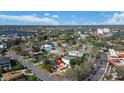Aerial view of a home in a waterfront community with mature trees, lush greenery, and beautiful views at 601 Cordova Ne Blvd, St Petersburg, FL 33704