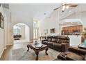 Spacious living room featuring vaulted ceilings and wood floors at 1001 Bayvista Dr, Tarpon Springs, FL 34689