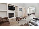 Cozy living room with fireplace and comfortable seating at 1001 Bayvista Dr, Tarpon Springs, FL 34689