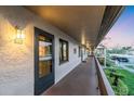 Condo exterior showing a walkway, outdoor lighting, and a view of the parking area at 204 Mary Dr, Oldsmar, FL 34677