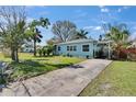 Charming single-story home featuring a well-manicured front yard and a welcoming pergola-covered entrance at 2661 45Th S St, Gulfport, FL 33711