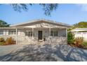 Inviting single-story house with a quaint porch and modern architectural details at 1489 77Th N Ave, St Petersburg, FL 33702