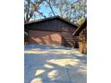 Spacious detached garage with a large door and a convenient driveway at 3010 County Road 31, Clearwater, FL 33759