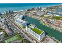 Aerial view of waterfront community with building near beach at 400 150Th Ave # 302, Madeira Beach, FL 33708