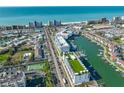 Aerial view of building, marina, and beach at 400 150Th Ave # 302, Madeira Beach, FL 33708