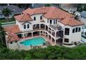 Luxury home aerial view showcases a large pool and spiral staircase at 109 Wateredge Ct, Safety Harbor, FL 34695