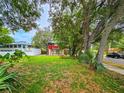 Home's lot has mature trees on a quiet street with ample green space at 1414 7Th S St, St Petersburg, FL 33701