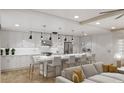 Modern kitchen with white cabinets and large island at 14046 Gulf Blvd # 1, Madeira Beach, FL 33708