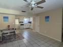 Bright kitchen and dining area combo with tile floors and white cabinets at 300 6Th N St # 8, Safety Harbor, FL 34695